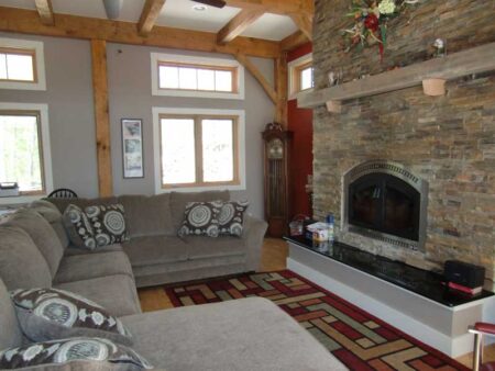 Vacation Rental Property - Bungalow - Orleans Mass., 9 Pond Road - Lake House Great Room Sectional showing Grandfather Clock and Fireplace