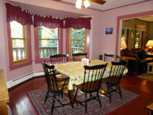 Dining 9 Pond Road Crystal Lake, Orleans MA - lakeside dining showing table, windows and deck